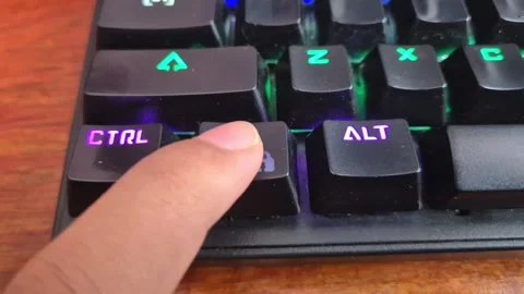 Finger pressing the Windows lock key on a mechanical keyboard Stock Footage 339017712