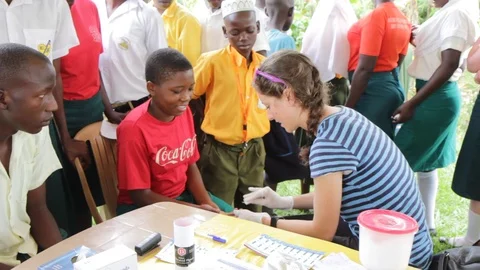 Finger-prick test for HIV in Uganda, Africa. Stock Footage 96176480