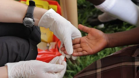 Finger-prick test for HIV in Uganda, Africa. Stock Footage 96176542
