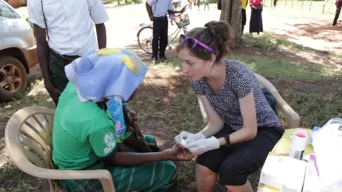 Finger-prick test for HIV in Uganda, Africa. Stock Footage 96380974