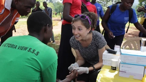 Finger-prick test for HIV in Uganda, Africa. Stock Footage 96381223