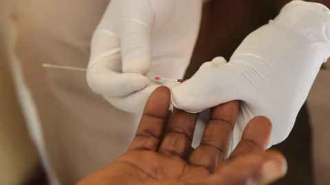 Finger-prick test for HIV in Uganda, Africa. Stock Footage