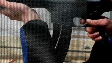 Finger pulling trigger of AR15 at shooting range Stock Footage 122106762