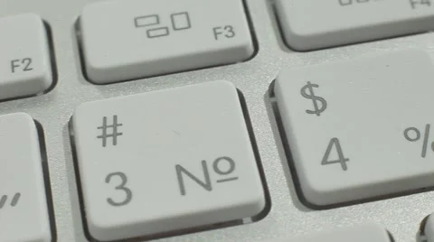 Finger Push $4% Button of the Macbook Keyboard. Close up slow panorama. Stock Footage 50474205