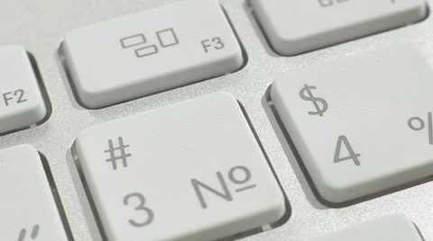 Finger Push $4% Button of the Macbook Keyboard. Close up slow panorama. Stock Footage 50474271