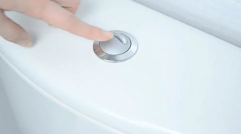Finger pushing button and flushing toilet Stock Footage 57907021