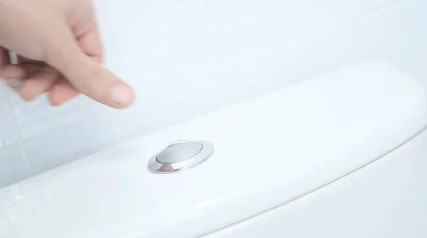Finger pushing button and flushing toilet Stock Footage 57908267