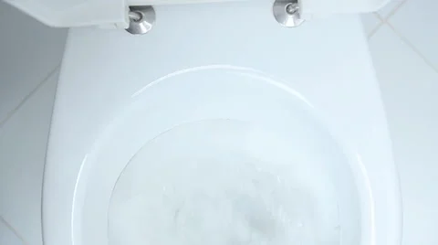 Finger pushing button and flushing toilet Stock Footage 57909328