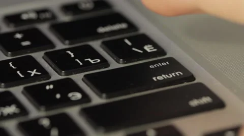 Finger pushing the button ENTER on the keyboard Video stock 56620772