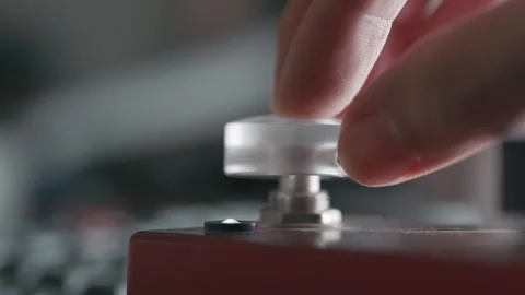Finger Pushing Control Button with Glowing Small Light Indicator Stock Footage 330253731