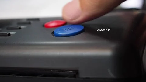 Finger pushing copy blue button on stencil copy machine to make a copy Stock Footage 279305427