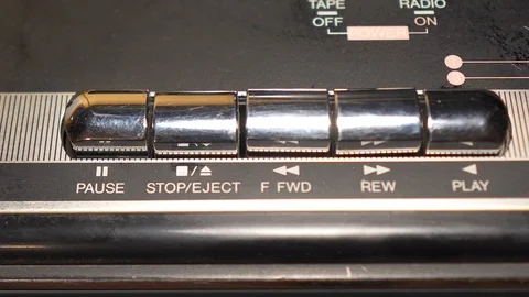 Finger is pushing PLAY and STOP buttons on audio player closeup view Video stock 111440366