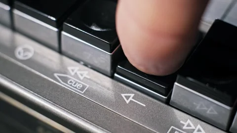 Finger Pushing Play Button on Cassette Player Macro Stock Footage 320572105