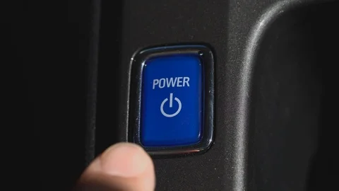 Finger is pushing a power button in electric car Stock Footage 91791267