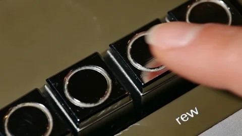 Finger pushing rewind then stop on vintage music cassette player 動画素材 88914763