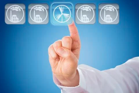 Finger Pushing Wind Power Button Over Blue Ground Stock Photos