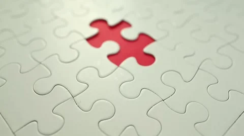 Finger put into missing pieces of puzzle Stock Footage 65125297