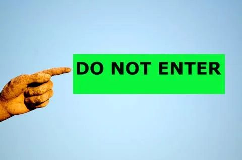 Finger with rectangular green label DO NOT ENTER Stock Photos