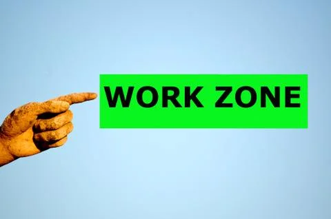 Finger with rectangular green label WORK ZONE Stock Photos