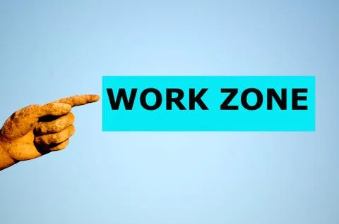 Finger with rectangular light blue label WORK ZONE Stock Photos