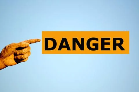 Finger with rectangular orange label DANGER Stock Photos