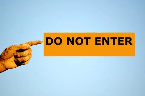 Finger with rectangular orange label DO NOT ENTER Stock Photos