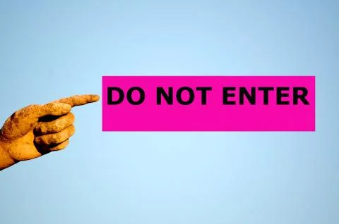 Finger with rectangular purple label DO NOT ENTER Stock Photos