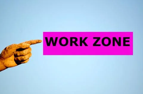 Finger with rectangular purple label WORK ZONE Stock Photos