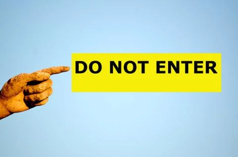 Finger with rectangular yellow label DO NOT ENTER Stock Photos