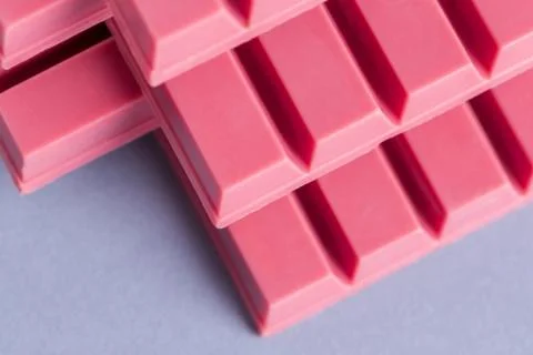 Finger Ruby Chocolate Bar made from ruby cocoa bean. New dimension of chocola Stock Photos