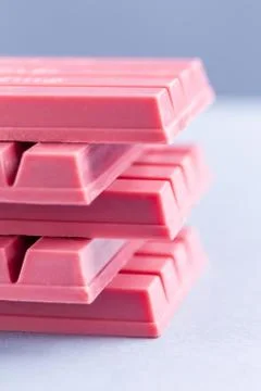 Finger Ruby Chocolate Bar made from ruby cocoa bean. New dimension of chocola Stock Photos