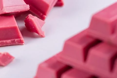 Finger Ruby Chocolate Bar made from ruby cocoa bean. New dimension of chocola Stock Photos