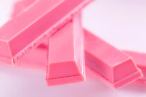 Finger Ruby Chocolate Bar made from ruby cocoa bean. New dimension of chocola Stock Photos