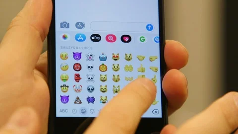 Finger Scrolling Emojis On A Phone Keyboard Stock Footage 127774053