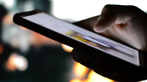 Finger scrolling facebook social network app on his phone. facebook by meta Stock Footage 201839257