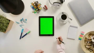 A Finger Scrolling on the Green Touchscreen Stock Footage 86039036
