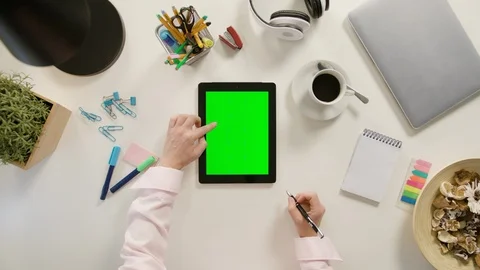 A Finger Scrolling on the Green Touchscreen Stock Footage 86040186