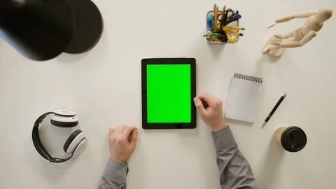 A Finger Scrolling on the Green Touchscreen Stock Footage 86095081