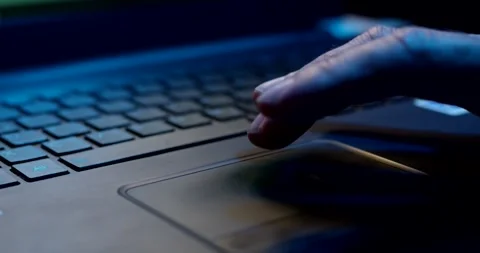 Finger Scrolling on a Laptop Touchpad, Dark Blue Light, Close Up Shot Stock Footage 340359691