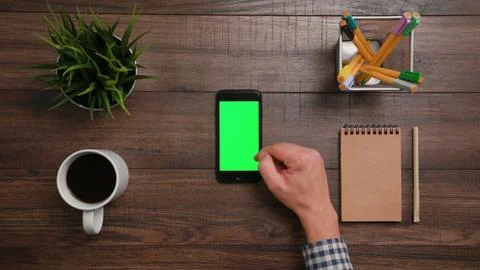 A Finger Scrolling on the Smartphone Stock Photos