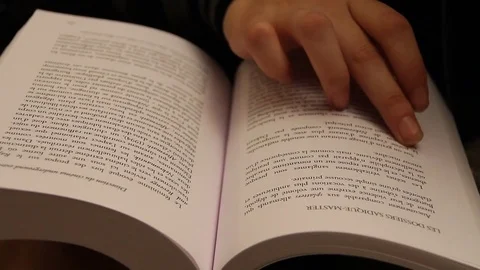 Finger scrolls book page Stock Footage 79047525