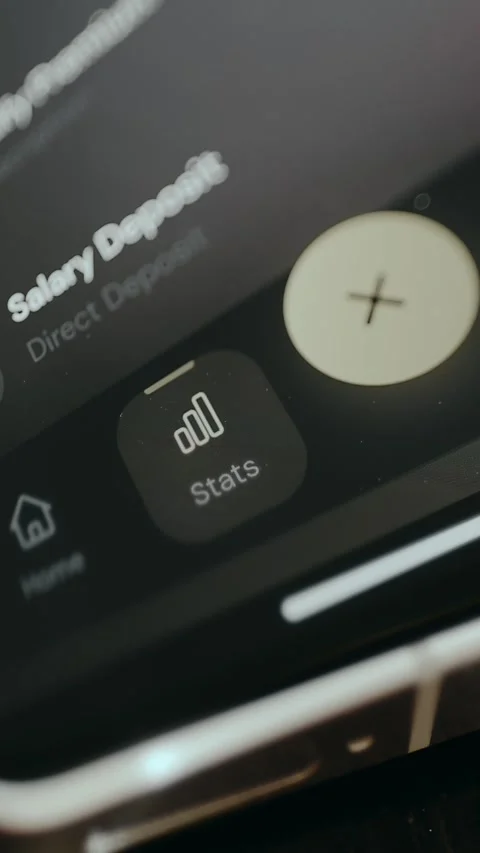 Finger selects Stats button in banking app interface Stock Footage 332500177