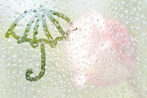 Finger-shaped pattern of the stripes of an umbrella on a translucent fogged g Foto stock