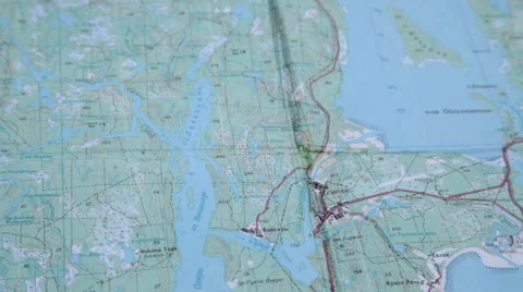 The finger shows a place on the map with ciryllic letters Video stock 62843736