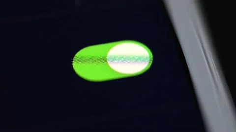 A finger switches on a function on a smartphone - macro detail 스톡 동영상 133587913