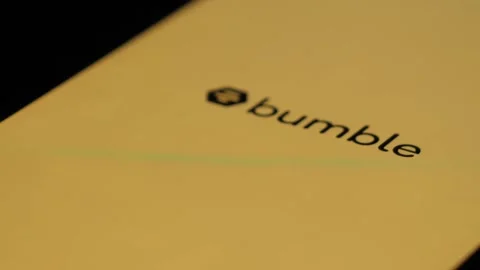 Finger Tapping On Bumble App Icon On Iphone To Open It. Macro Close Up Shot Stock Footage 247622106