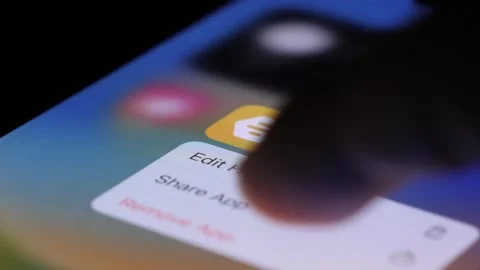 Finger Tapping On Bumble Icon On Phone Screen And Deleting App. Close Up Stock Footage 247548228