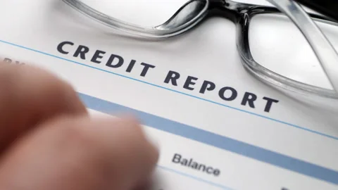 Finger tapping on credit report Stock Footage