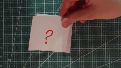 Finger tapping question mark note over exclamation mark Stock Footage 341269351