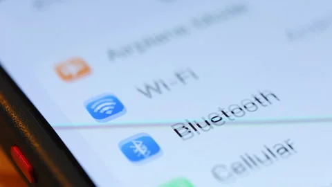 Finger tapping Settings app icon on iPhone screen. Close up of iOS interface, Stock Footage 334023399